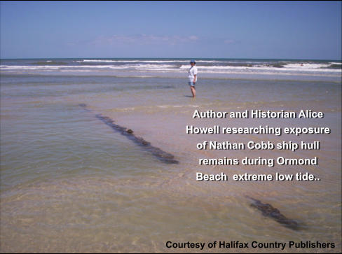 Author and Historian Alice Howell researching exposure of Nathan Cobb ship hull remains during Ormond Beach  extreme low tide.. Courtesy of Halifax Country Publishers